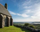 From churches and castles to wonderfully weird Portmeirion: exploring Wales’s north-west coast on foot and by train